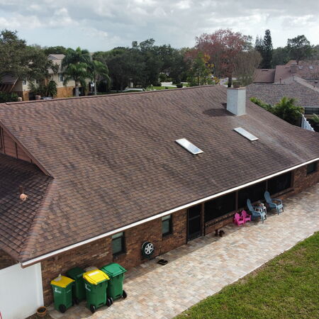 Drone shot dirty red shingle roof Photo Optimized