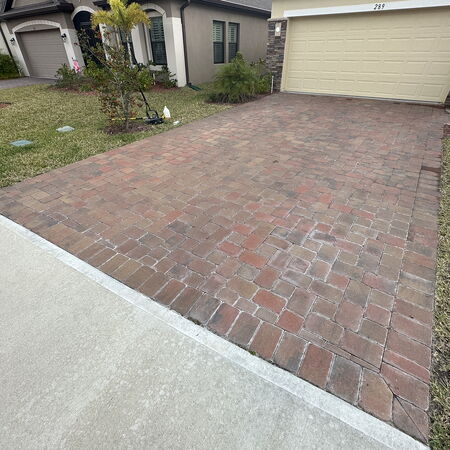 Before photo of red brick pavers with white chalkiness effloresc