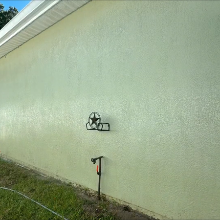 Seafoam green home after being soft washed very clean