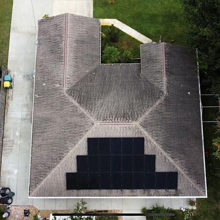 Drone aerial shot of dirty roof before soft wash