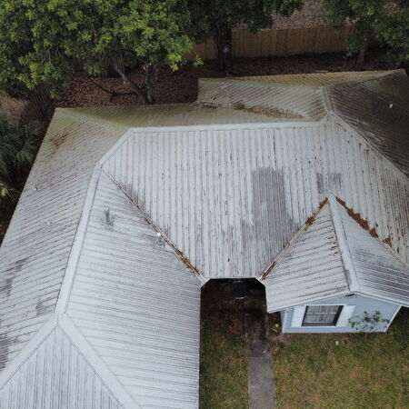 Drone aerial shot metal roof before cleaning