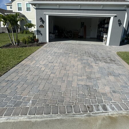 Before photo of driveway covered with efflorescence and haziness